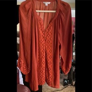 Orange blouse. This blouse will go with jeans or dress slacks